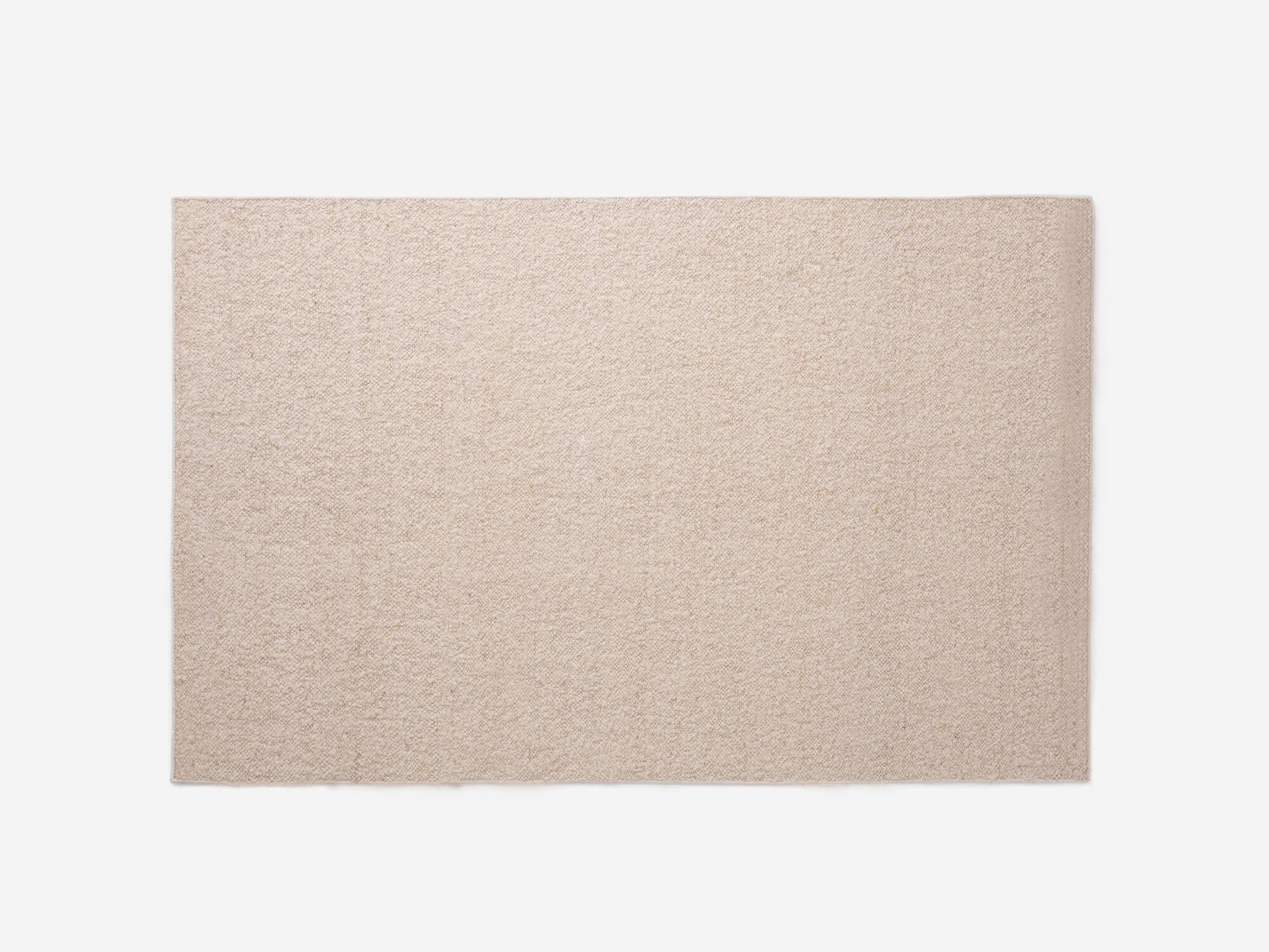 Large cream area rug top view